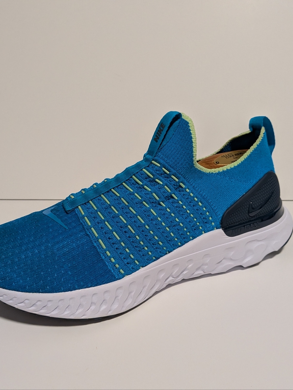 Nike Men'sReact Phantom Run Flyknit 2 running shoes in a blue and green colorway